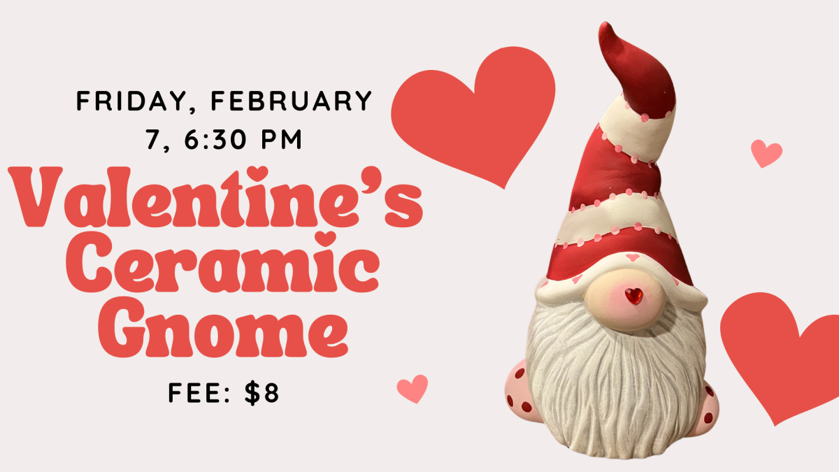 A ceramic gnome painted for valentines day